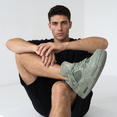Olive green Air Jordan 4 sneakers with Jumpman tongue and NIKE AIR heel branding