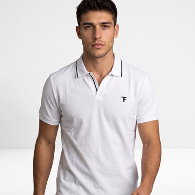 white Tom Ford polo with black piping and TF logo on chest