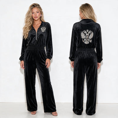 black velvet jumpsuit with half zip, elastic waist and embroidered crest on chest and back