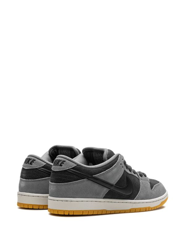 Nike Dunk Low grey and black sneaker with gum sole, side view