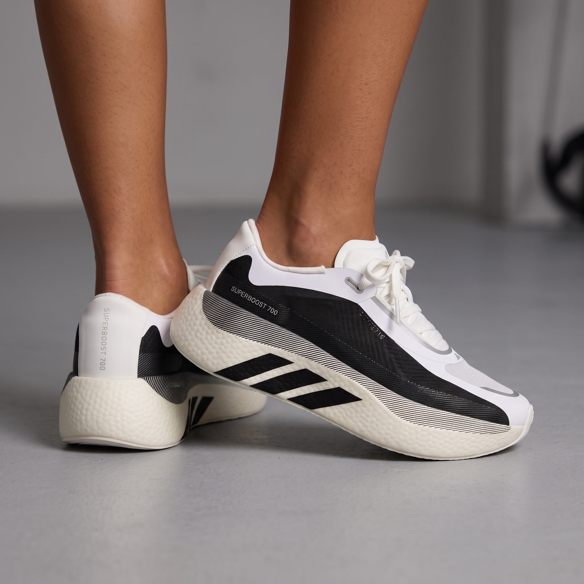 Adidas Superboost 700 white and black sneakers with thick cushioned midsole