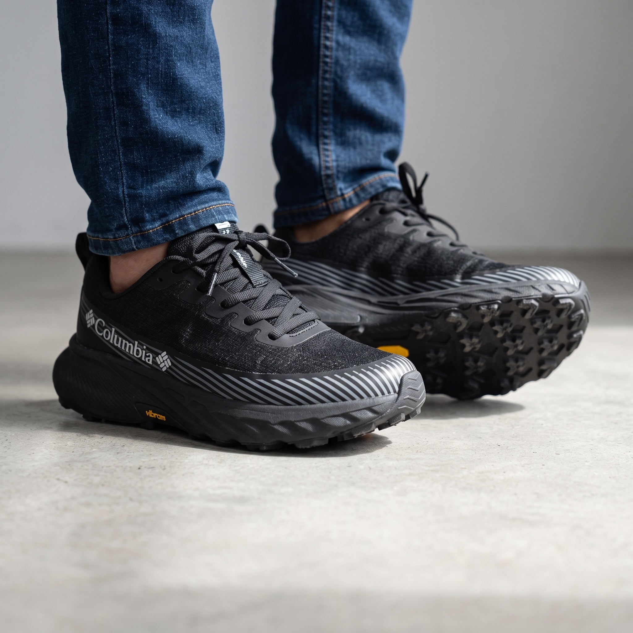 Columbia black low-top runner with Vibram sole and grey stripe accents
