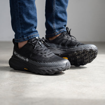 Columbia black low-top runner with Vibram sole and grey stripe accents