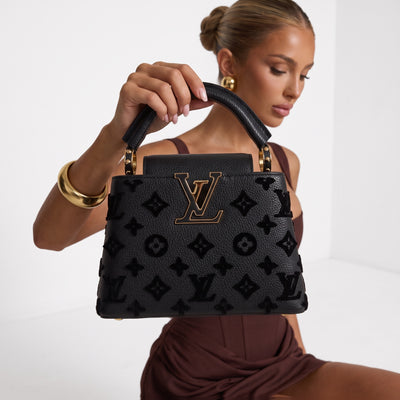 Black Louis Vuitton Capucines BB top-handle bag with gold LV plaque and monogram motif