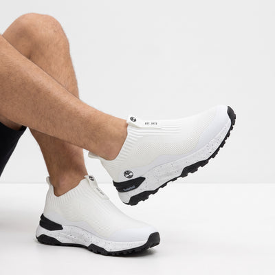 Timberland white knit slip-on sneaker with speckled midsole and black lug outsole