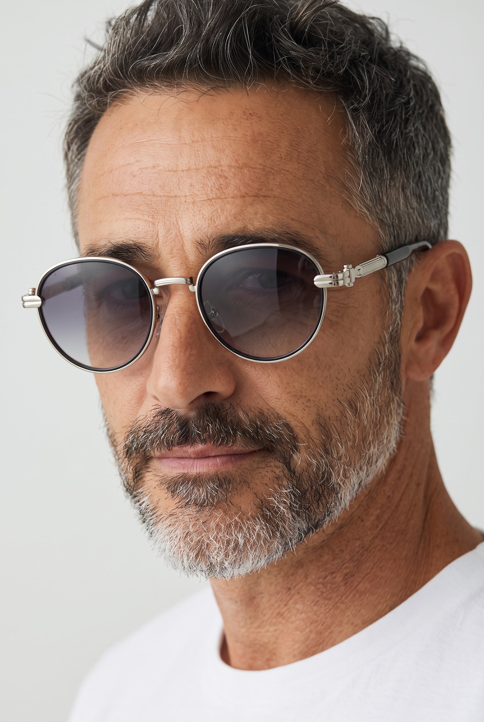Round silver frame sunglasses with gradient lenses and decorative metal hinges