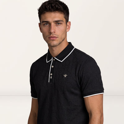black short-sleeve polo with white piping, embossed logo pattern and metal bee emblem