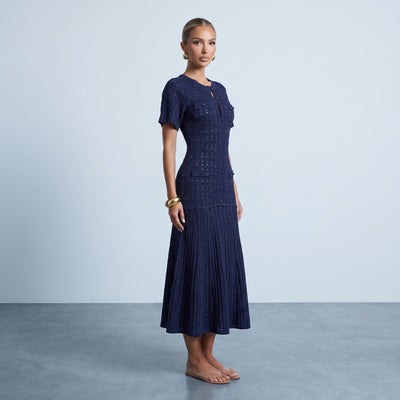 navy knit midi dress with button front, short sleeves and pleated skirt