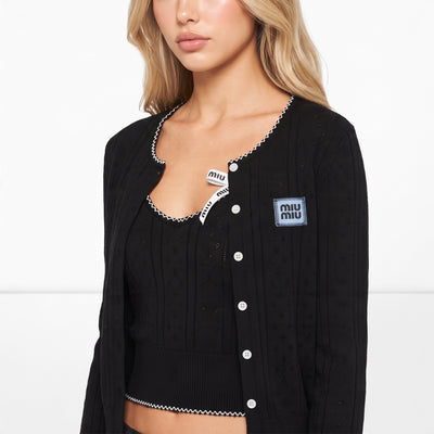 Miu Miu black rib knit cardigan and cropped tank with white scallop trim and logo ribbon bows