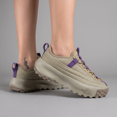 beige The North Face sneaker with purple webbing and chunky lug sole