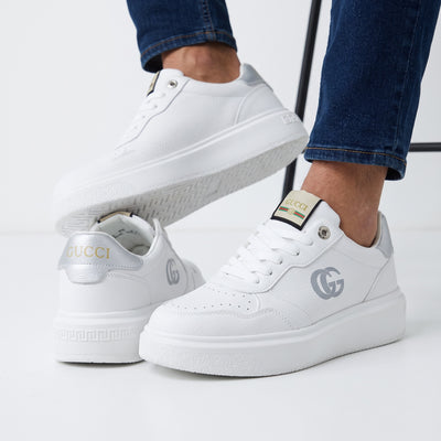 White Gucci platform low-top sneakers with silver heel tab and double-G logo