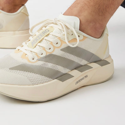 Adidas Adizero cream and grey low-top sneakers with chunky Lightstrike Pro midsole