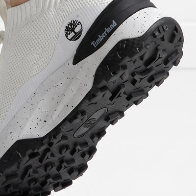 Timberland white knit slip-on sneaker with speckled midsole and black lug outsole