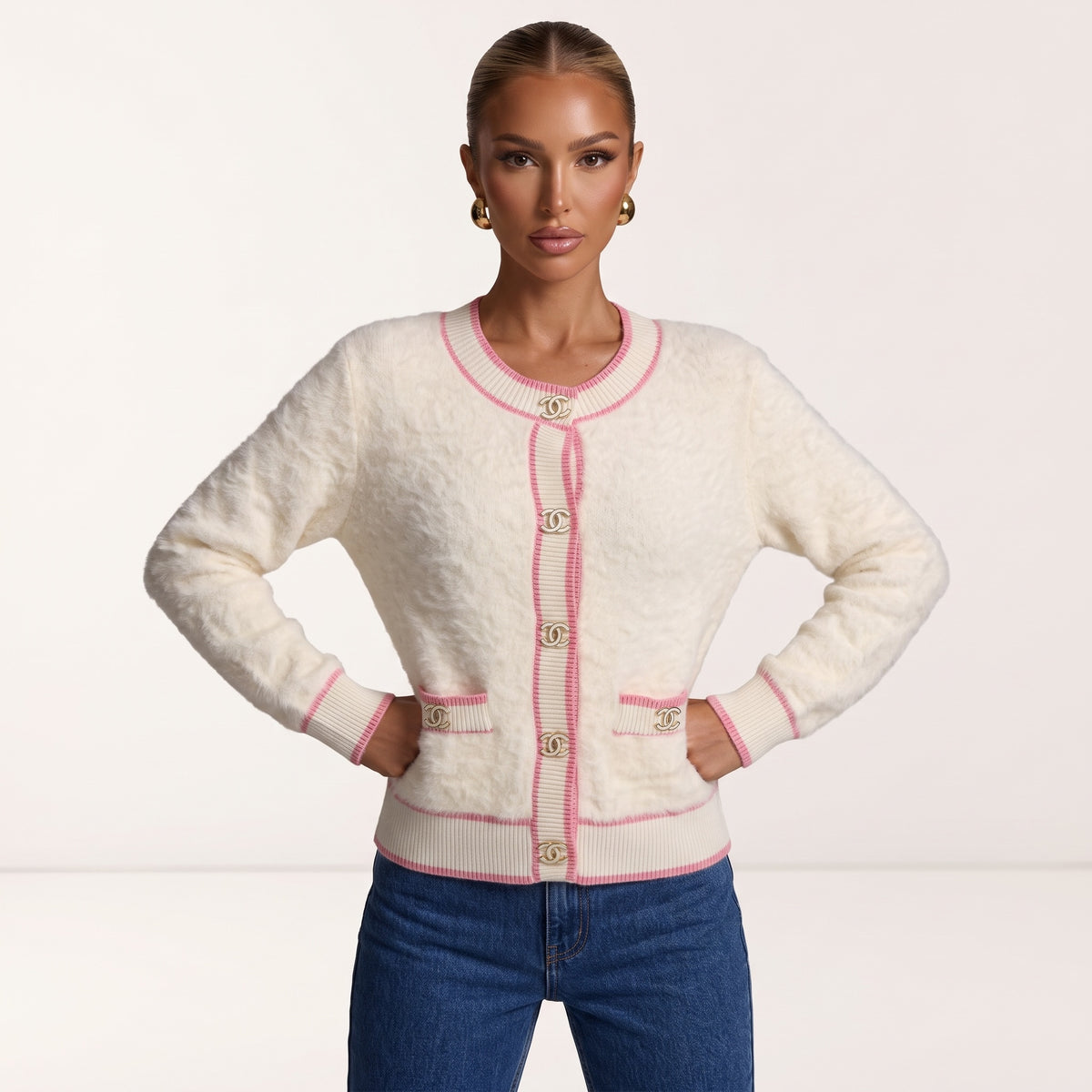 Cream fuzzy cardigan with pink trim and gold Chanel CC buttons