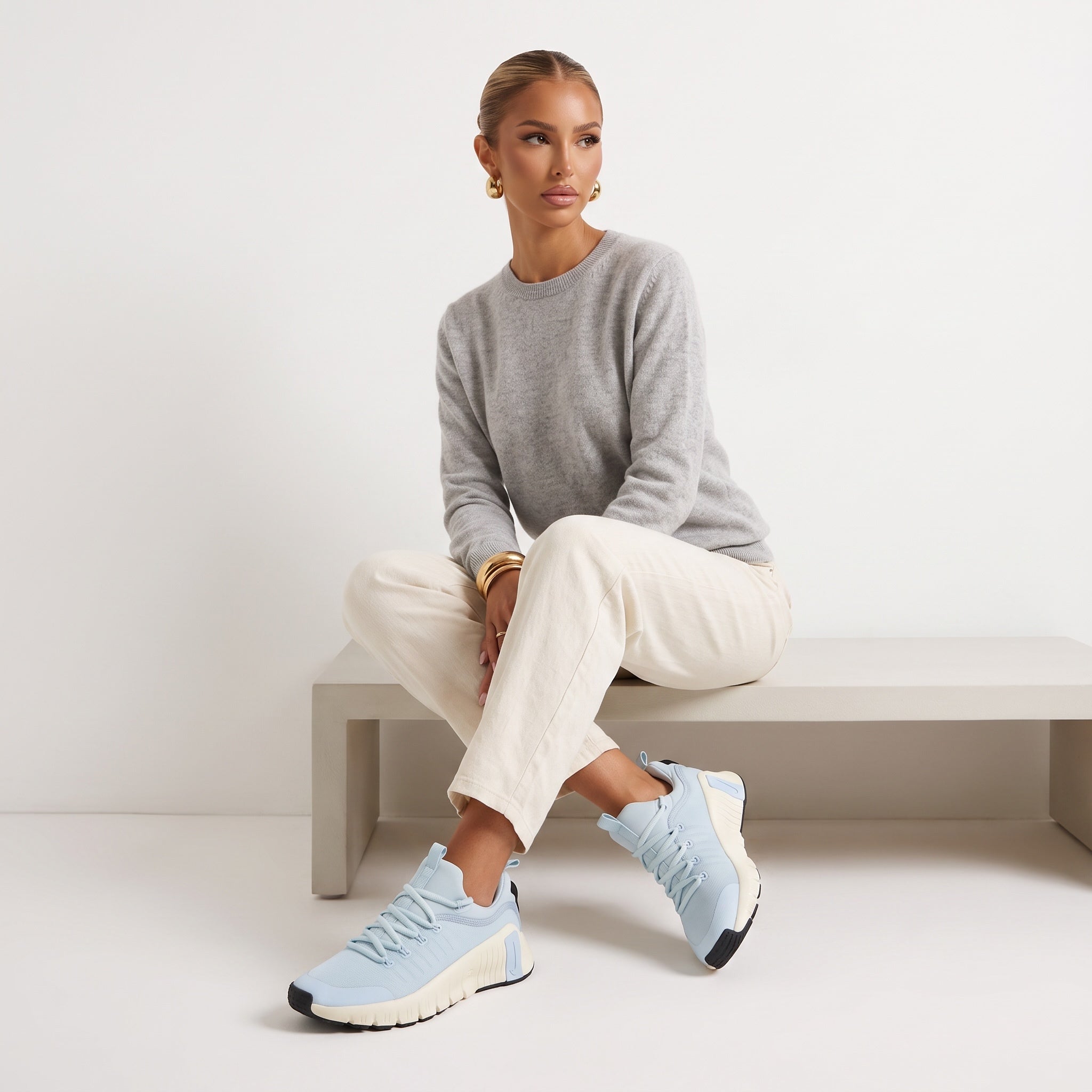 Light blue chunky Nike sneakers with cream midsole and black outsole
