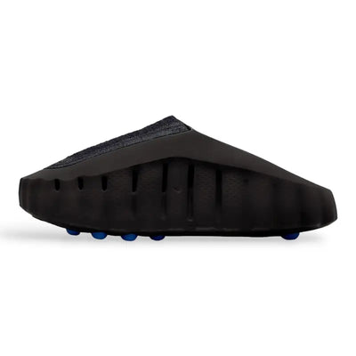 Black Nike Mind slip-on clog with blue circular pods on the sole