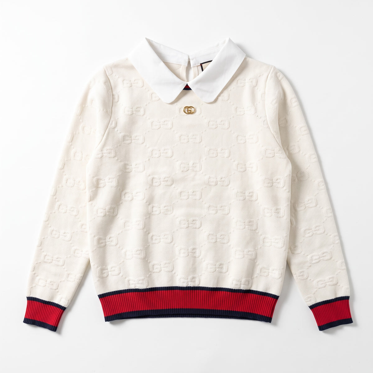 Cream white Gucci knit sweater with polo collar, gold double‑G button and navy-red ribbed hem