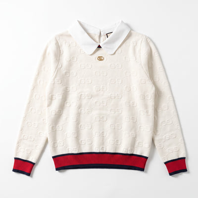 Cream white Gucci knit sweater with polo collar, gold double‑G button and navy-red ribbed hem