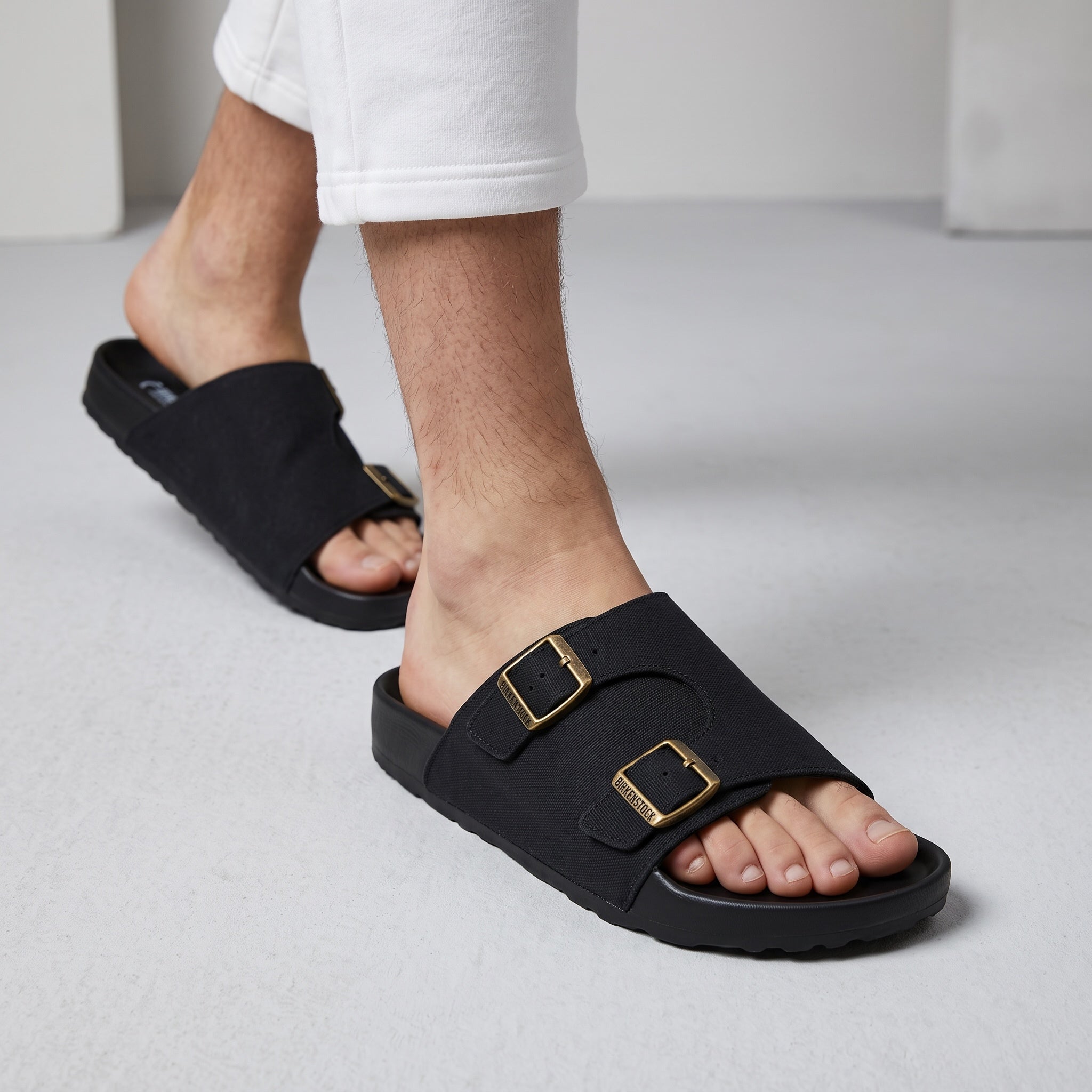 Black Birkenstock Arizona double-buckle slide sandal on model foot