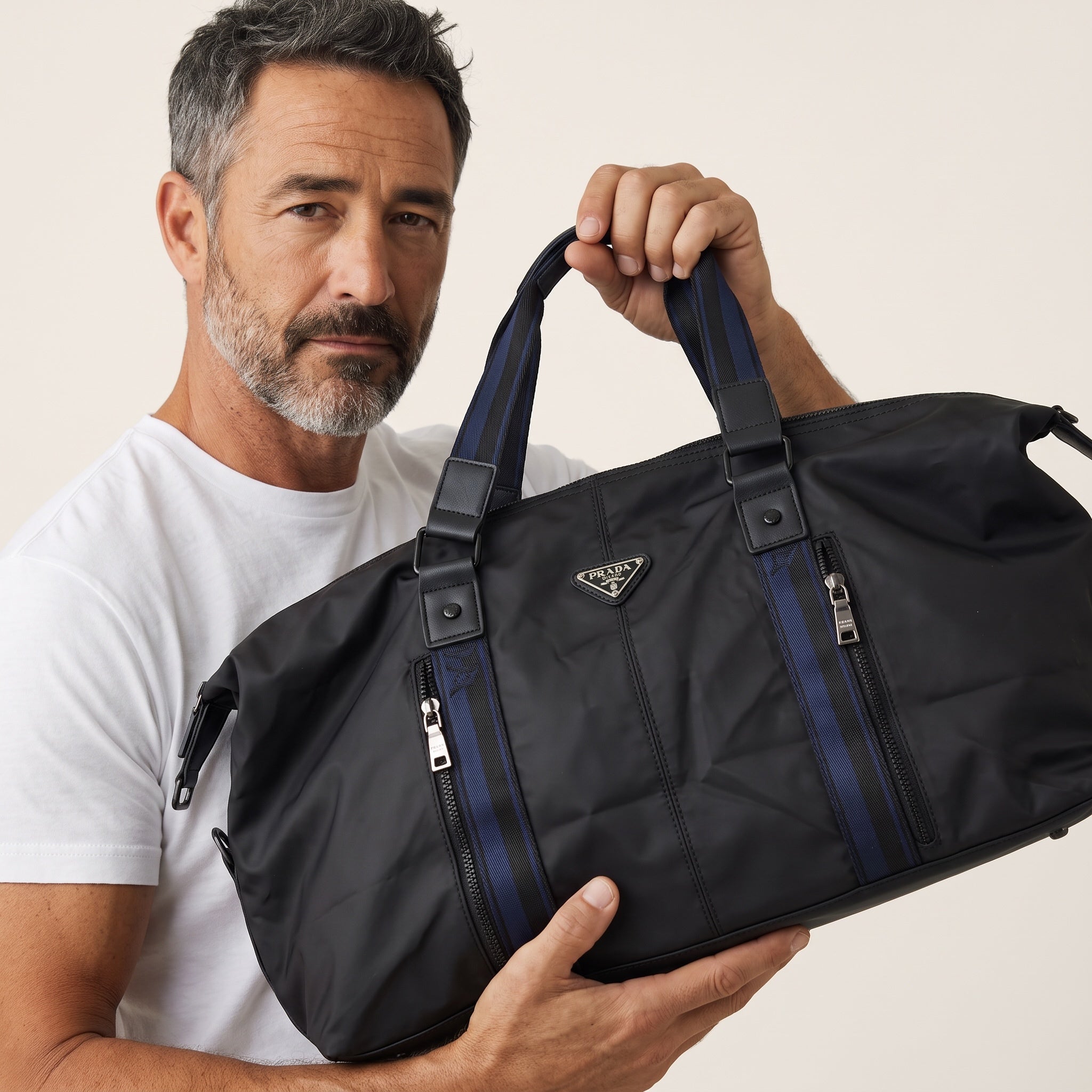 Prada black nylon weekender bag with blue striped handles and triangle logo
