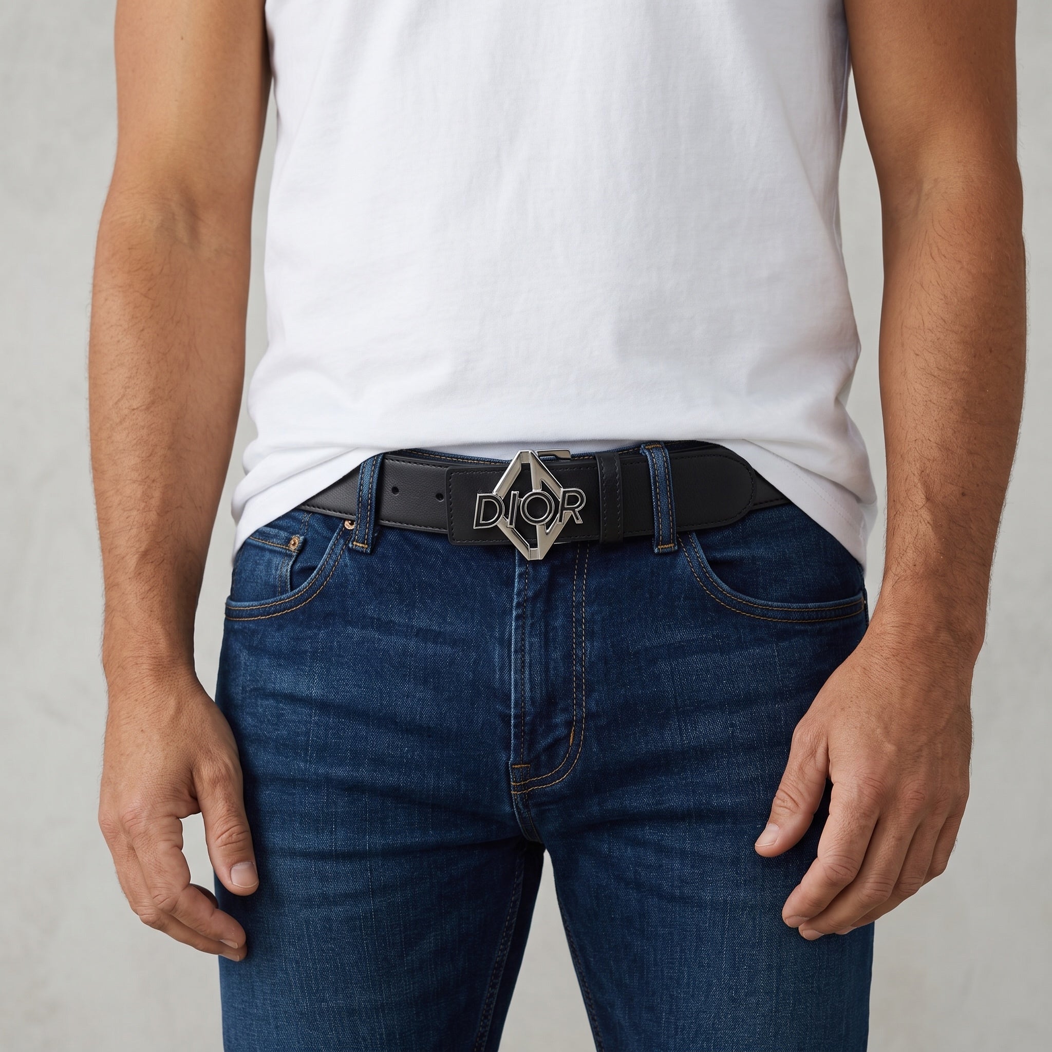 Black Dior belt with metal Dior logo buckle worn with jeans