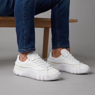 All-white Adidas Stan Smith low-top sneakers with chunky ribbed sole and rope detail
