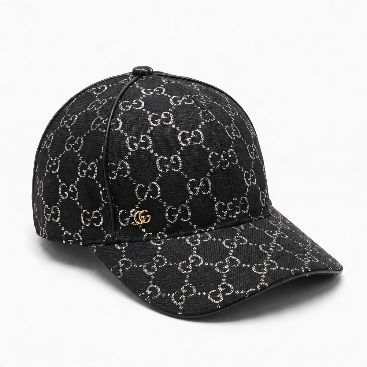 Black Gucci baseball cap with repeating GG pattern and small gold double-G logo.