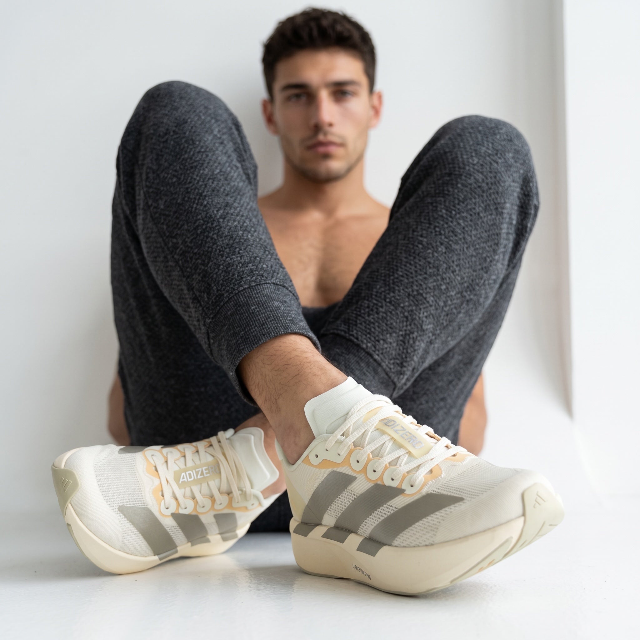 Adidas Adizero cream and grey low-top sneakers with chunky Lightstrike Pro midsole