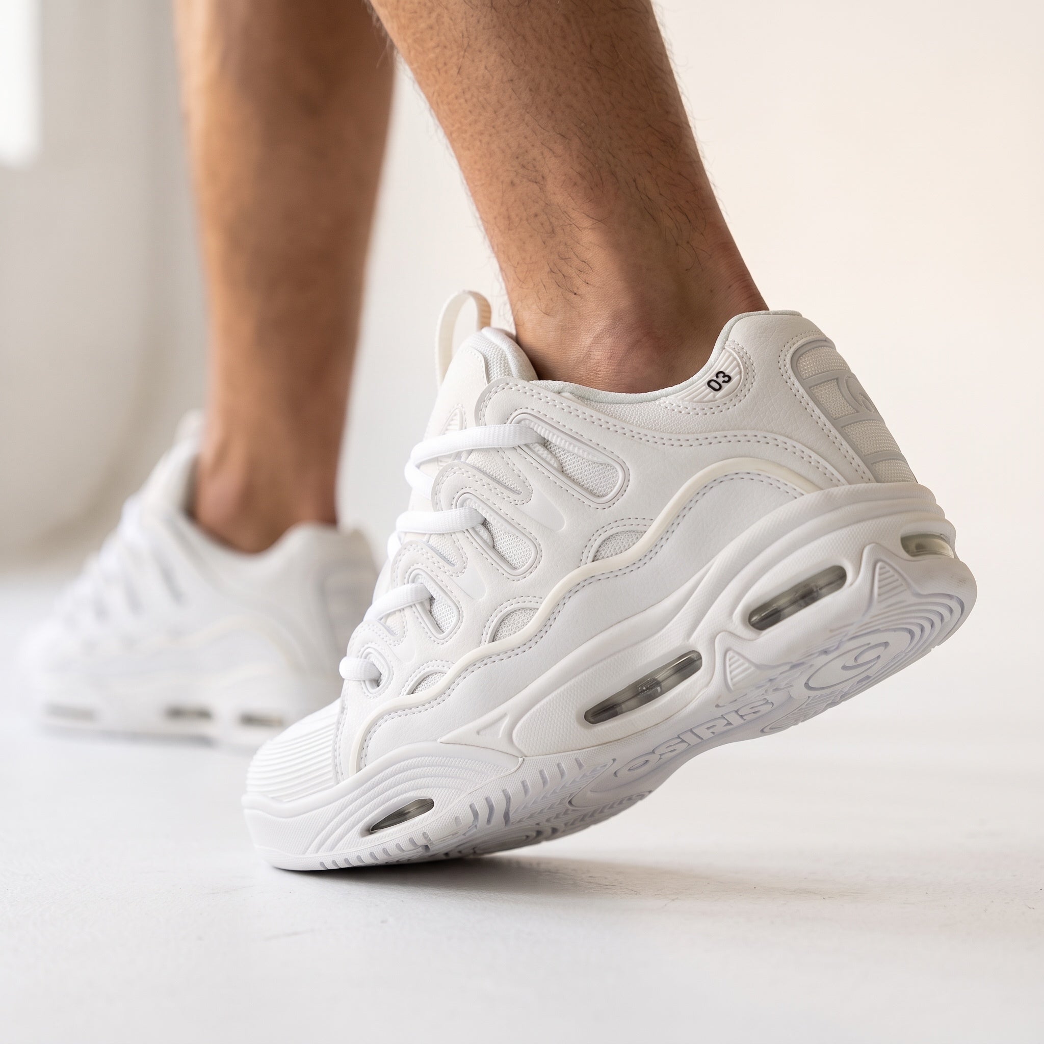All‑white Osiris D3 chunky sneakers with layered upper and visible sole windows