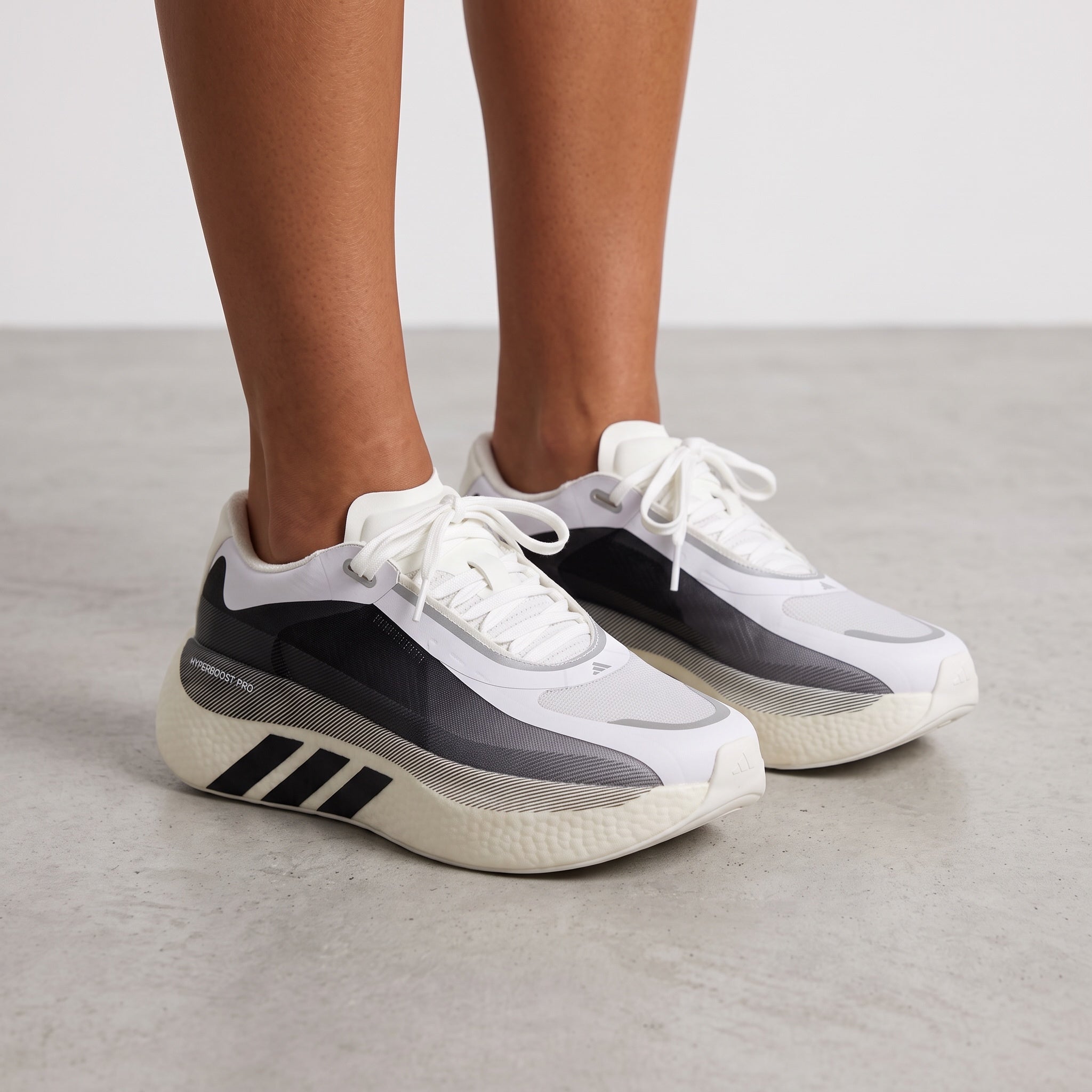 Adidas Superboost 700 white and black sneakers with thick cushioned midsole