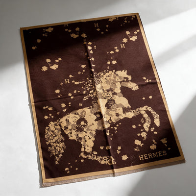 Hermès brown floral shawl with fringed edges folded and draped