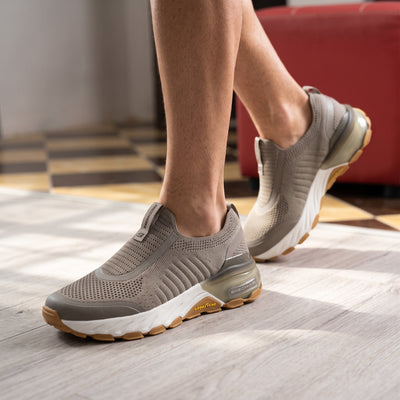 Skechers taupe knit slip-on sneaker with chunky white midsole and gum Goodyear outsole