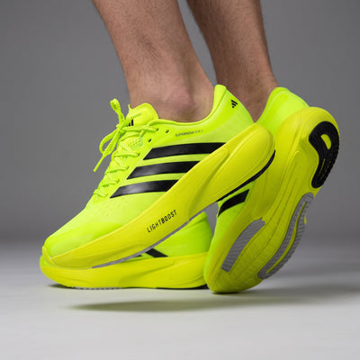 Adidas Adizero Supernova neon yellow running sneakers with black stripes
