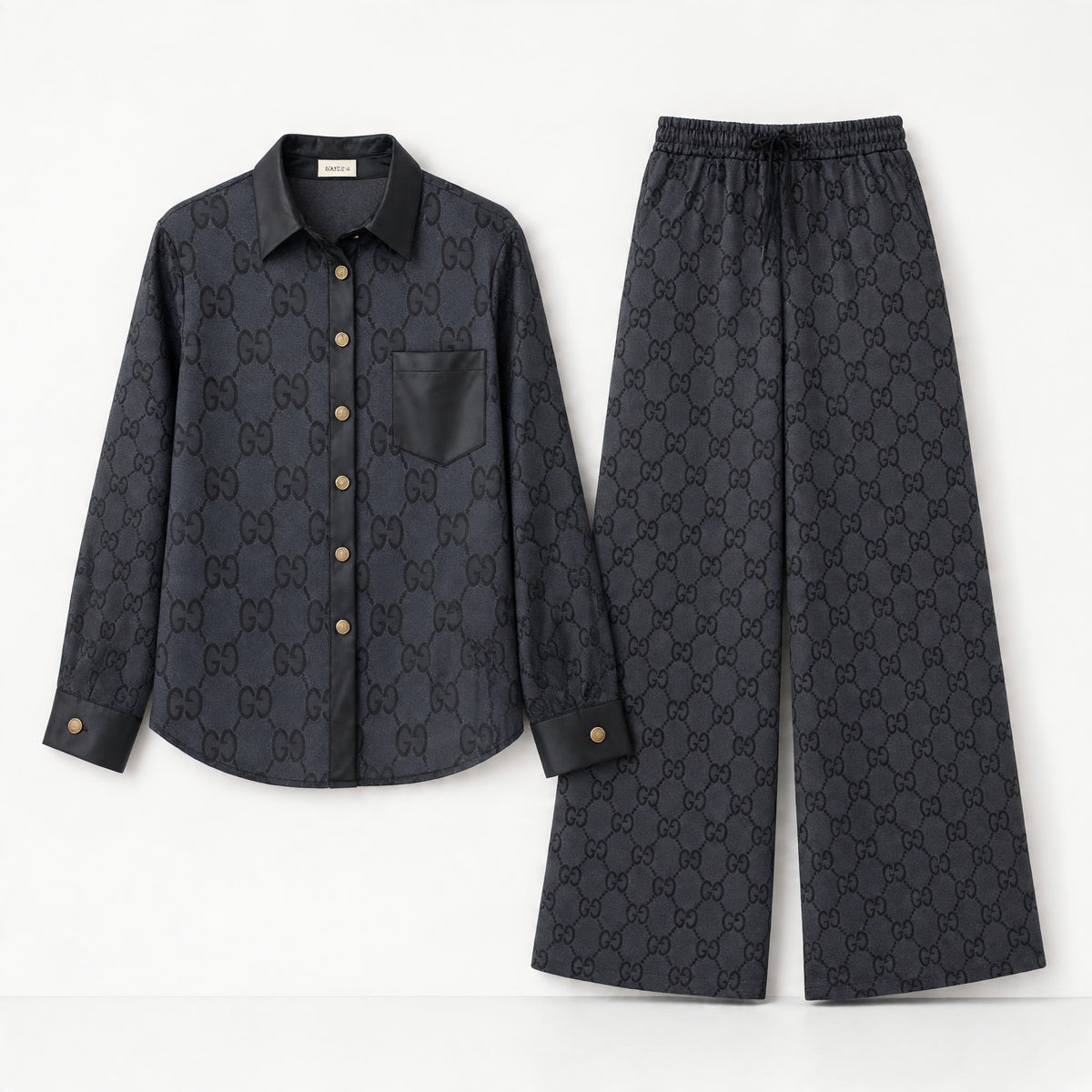 Black Gucci monogram shirt and wide-leg trousers set with contrast trim and gold buttons