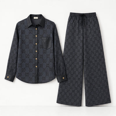 Black Gucci monogram shirt and wide-leg trousers set with contrast trim and gold buttons
