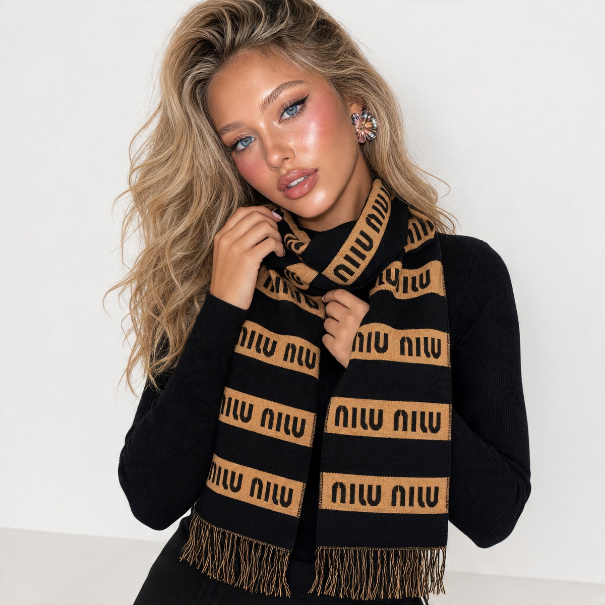 Black and brown Miu Miu knit scarf with repeated logo bands and fringe