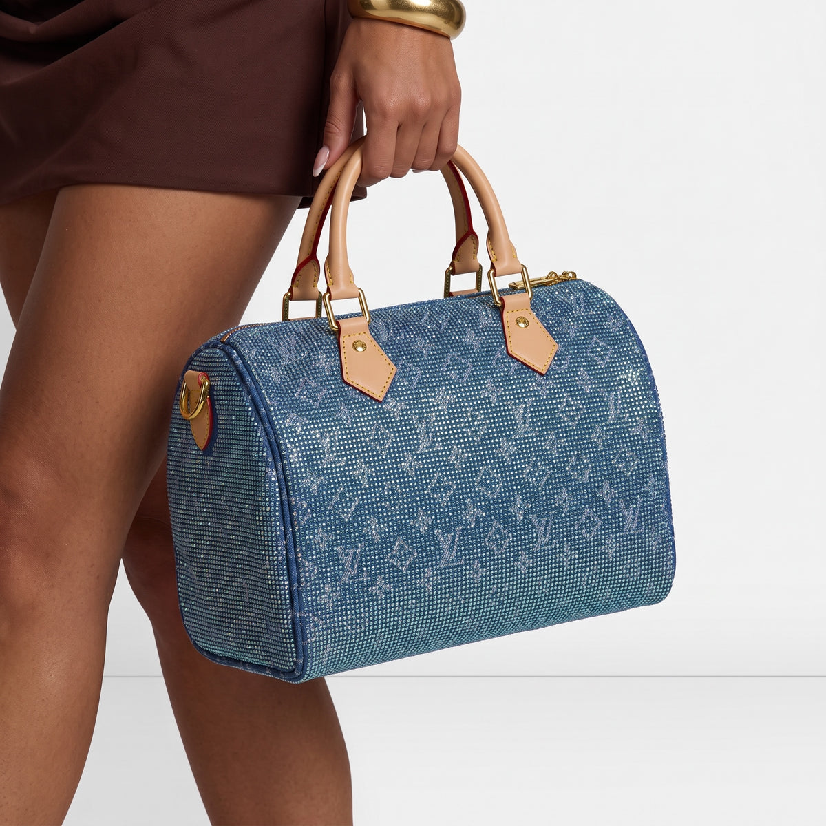 Blue Louis Vuitton monogram top-handle bag with crystal-like embellishment and beige handles
