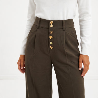 Brown high-waist trousers with gold decorative buttons down the front