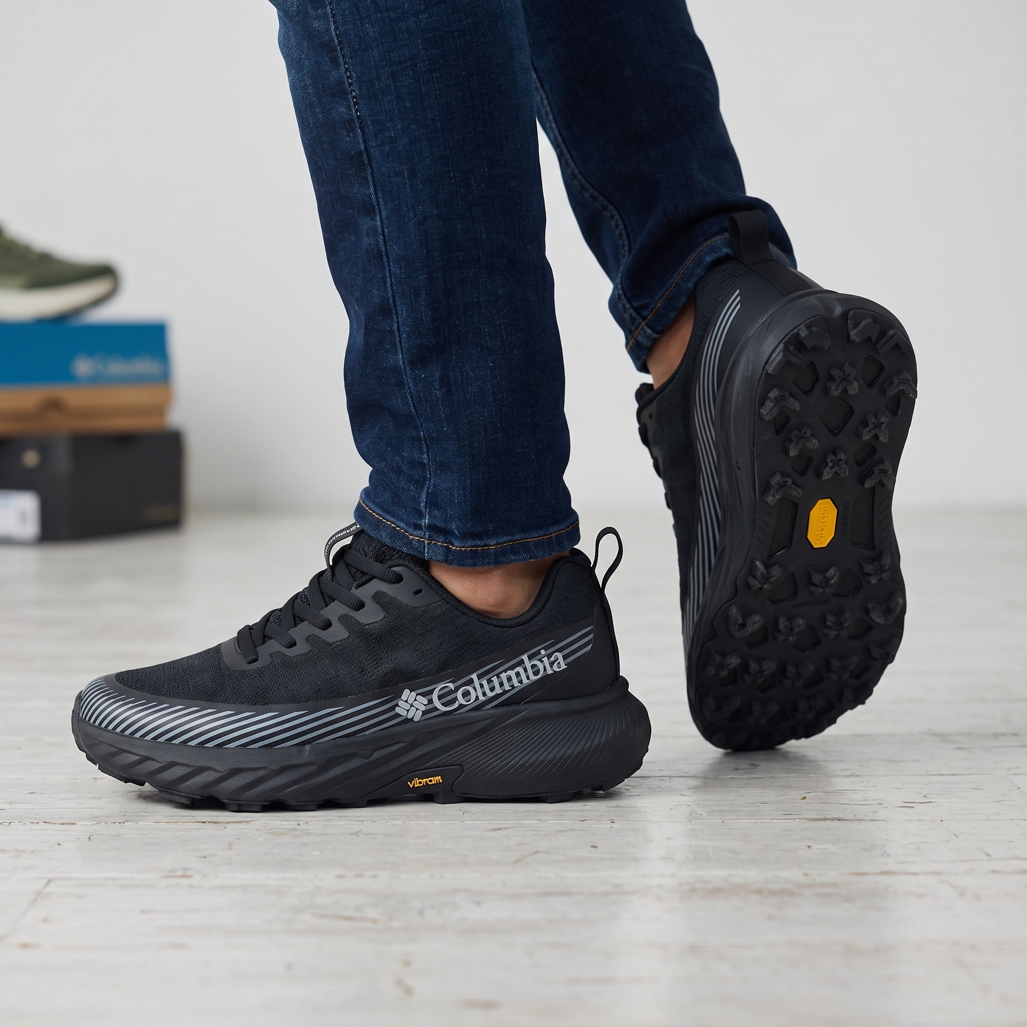 Columbia black low-top runner with Vibram sole and grey stripe accents