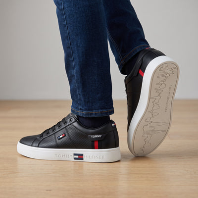 Tommy Hilfiger black low-top court sneakers with white cupsole and flag detail
