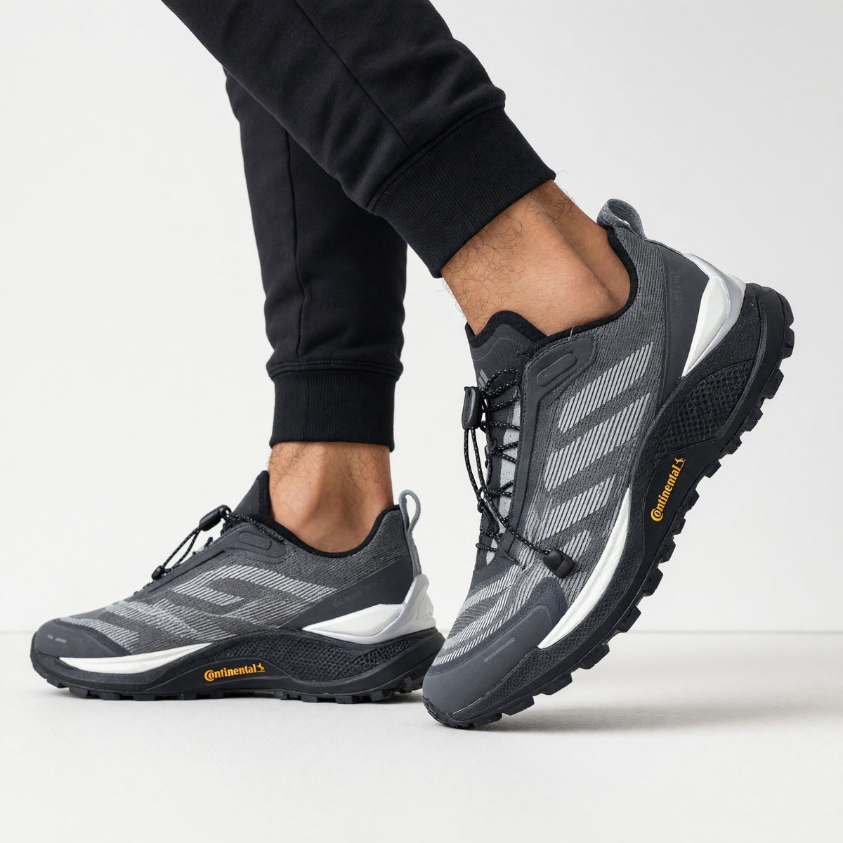 grey adidas trail sneaker with Continental outsole and toggle lacing