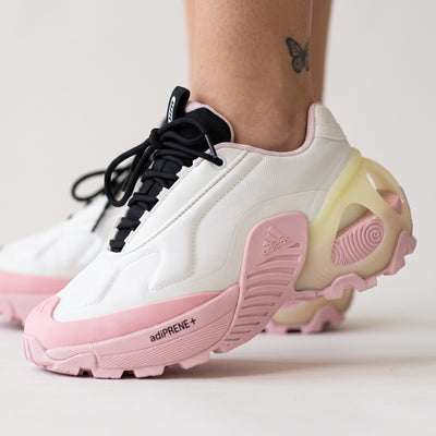 White and pink Adidas chunky platform sneaker with sculpted adiPRENE+ sole and black tongue