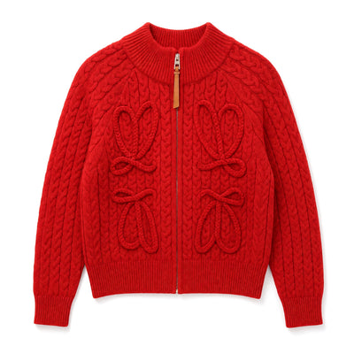 Red cable-knit zip cardigan with leather zipper pull and ribbed collar