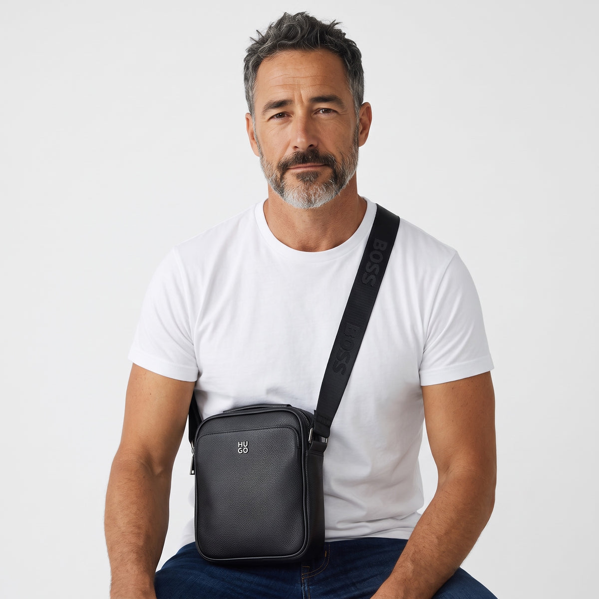 HUGO black pebbled crossbody bag with embossed strap and dual zip pockets