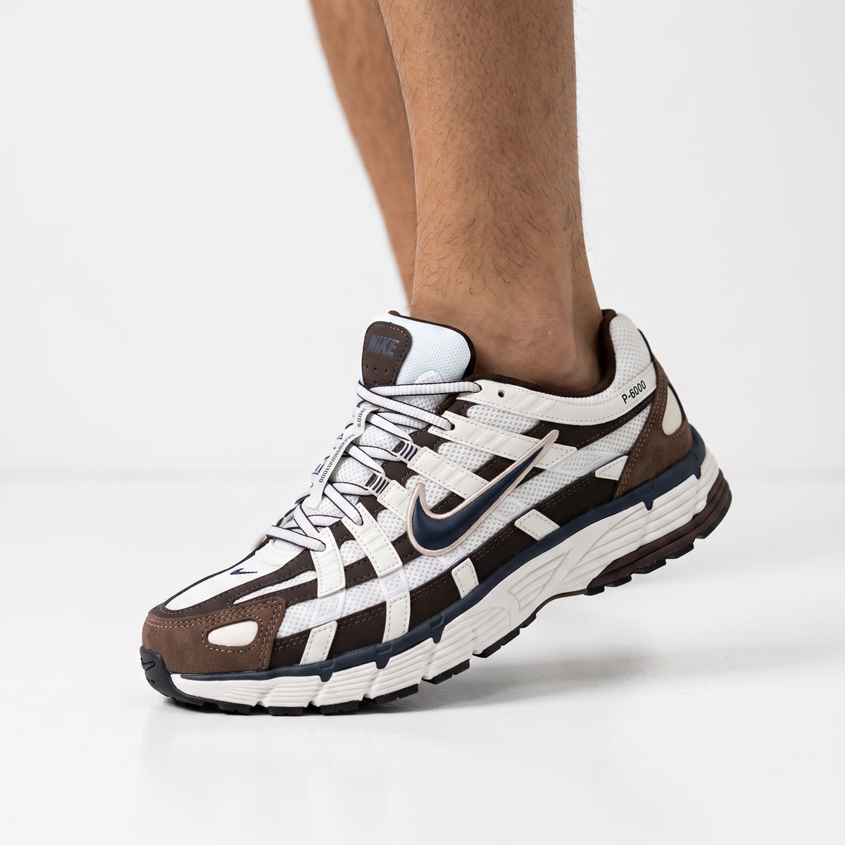 Nike P-6000 brown and white retro trainer sneaker on foot