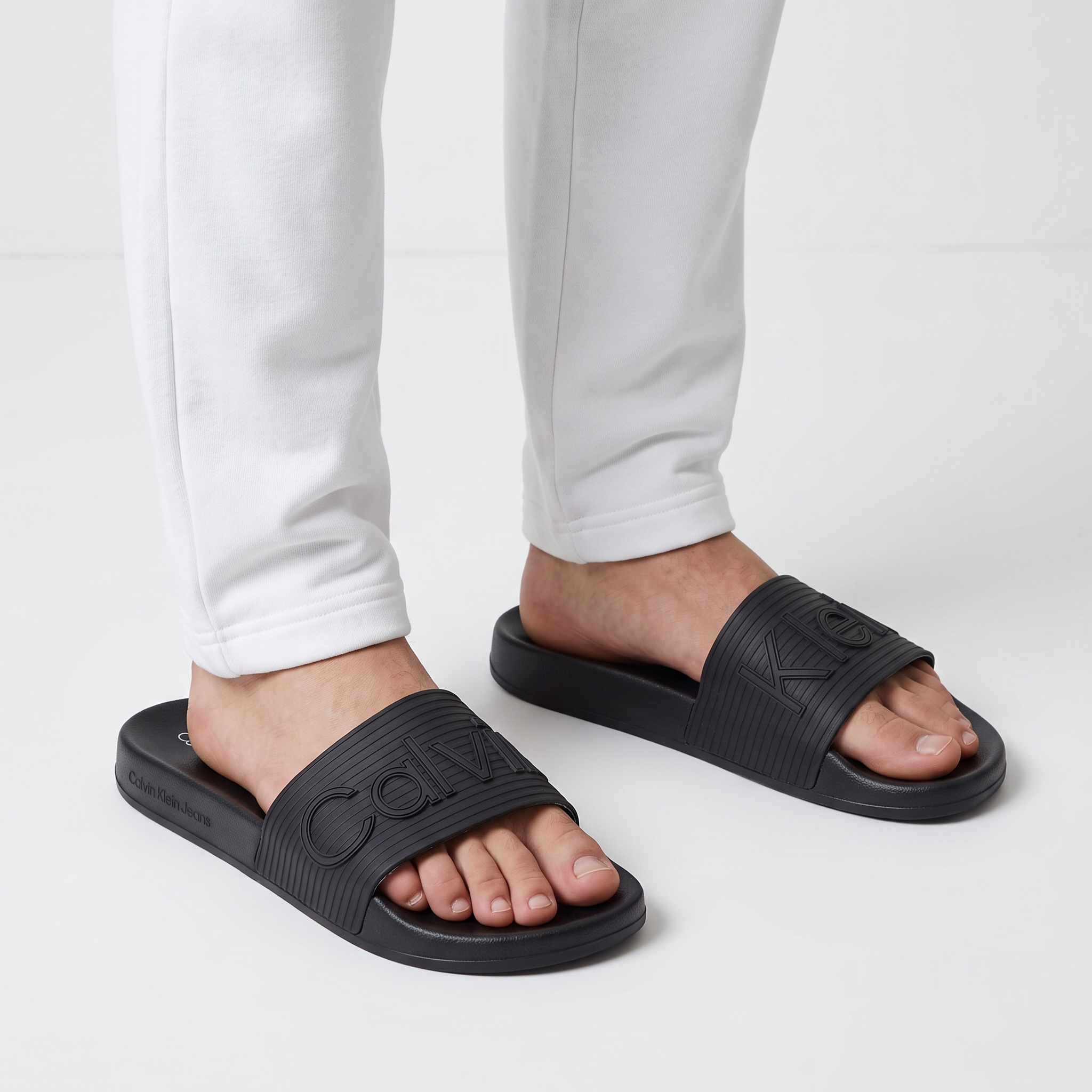 Calvin Klein Jeans Triple Black Slides – Minimalist Comfort & Modern Style