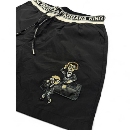 Dolce & Gabbana King Cartoon Black Swim Shorts – Iconic Designer Edition