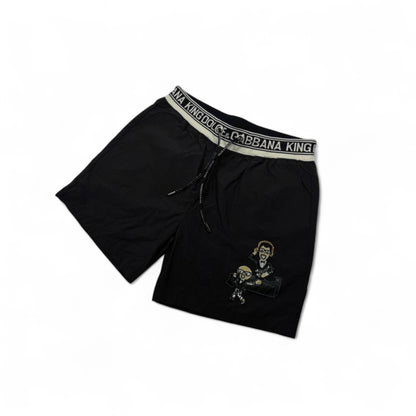 Dolce & Gabbana King Cartoon Black Swim Shorts – Iconic Designer Edition