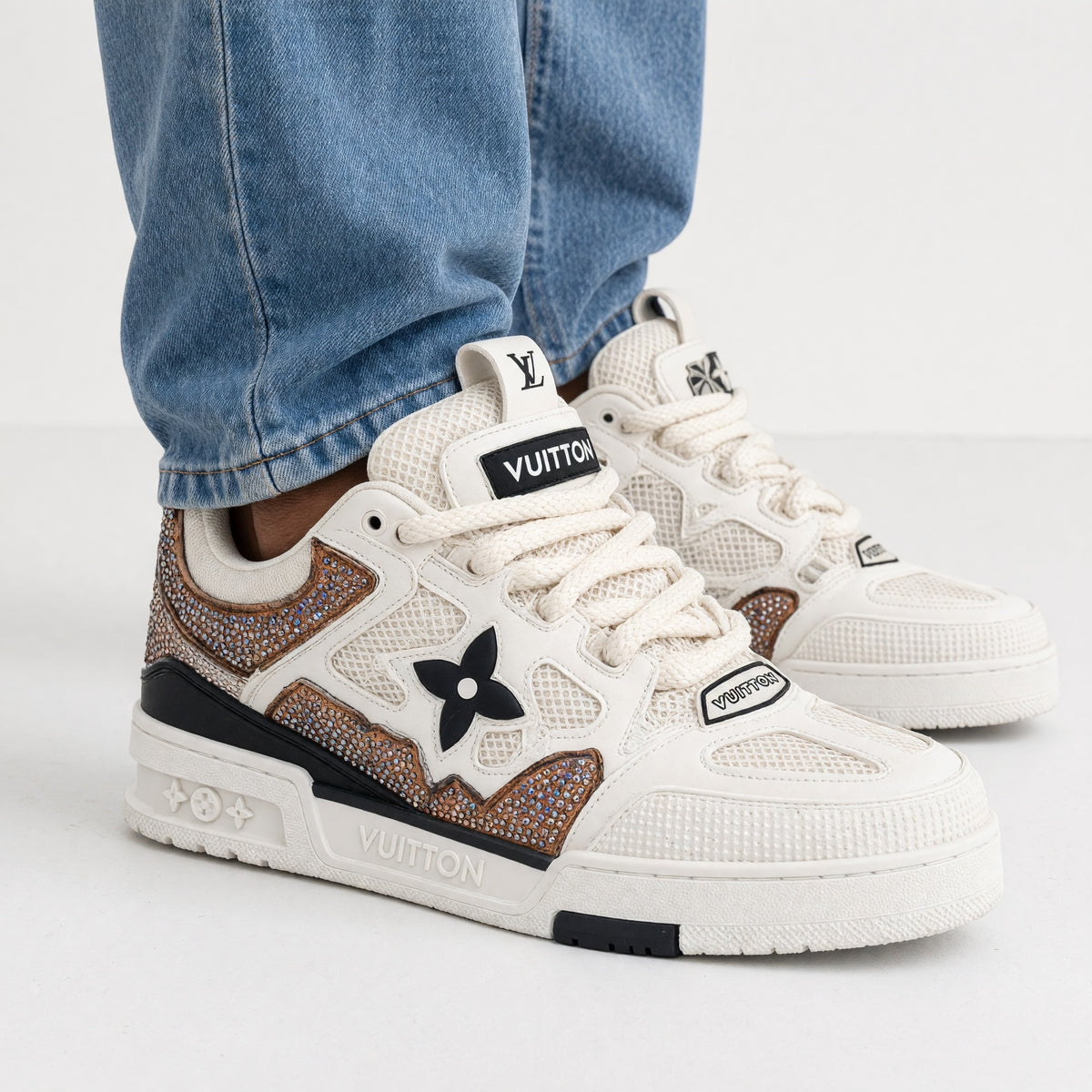 White Louis Vuitton chunky trainer with mesh panels and crystal-embellished copper accents