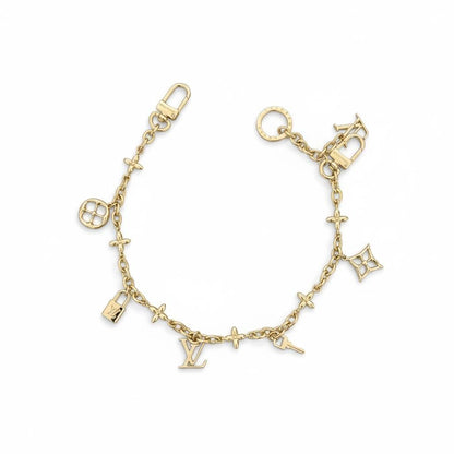 Louis Vuitton Gold Bag Charm – Iconic LV Monogram Accessory ✨💛